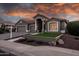 Beautiful exterior view of the single story home, showcasing a well-manicured yard at 1932 S Arroyo Ln, Gilbert, AZ 85295