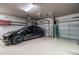 Garage interior with EV charger, overhead storage and ample space at 1932 S Arroyo Ln, Gilbert, AZ 85295
