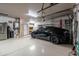 Garage interior with EV charger, overhead storage and plenty of space at 1932 S Arroyo Ln, Gilbert, AZ 85295