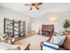 Spacious living room with wood-look flooring, neutral walls, and comfortable seating arrangements at 1932 S Arroyo Ln, Gilbert, AZ 85295