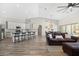 Expansive open living space showcasing a modern kitchen, dining area, and a cozy living room with contemporary finishes at 1932 S Arroyo Ln, Gilbert, AZ 85295