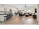 Open-concept living space with kitchen, dining, and living areas featuring wood-look floors and ample natural light at 1932 S Arroyo Ln, Gilbert, AZ 85295
