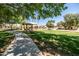 A serene park scene includes walking paths, shaded picnic areas, and lush green lawns at 1932 S Arroyo Ln, Gilbert, AZ 85295