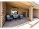 Inviting covered patio with comfortable seating, perfect for outdoor relaxation and entertaining at 1932 S Arroyo Ln, Gilbert, AZ 85295