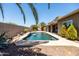 Backyard pool with covered patio and well-maintained landscaping create an ideal outdoor space at 1932 S Arroyo Ln, Gilbert, AZ 85295