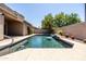 Private pool featuring waterfall, desert landscaping, and ample room for outdoor entertaining at 1932 S Arroyo Ln, Gilbert, AZ 85295