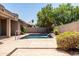 Backyard pool featuring manicured landscaping and mature trees at 1932 S Arroyo Ln, Gilbert, AZ 85295