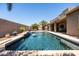 Beautiful pool featuring a waterfall, desert landscaping, and plenty of space to entertain at 1932 S Arroyo Ln, Gilbert, AZ 85295