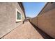 View of the side yard with a shed and ample room for storage at 1932 S Arroyo Ln, Gilbert, AZ 85295