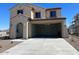 Charming two-story home with a neutral-colored exterior, complemented by a spacious two car garage at 19889 W Annika Dr, Litchfield Park, AZ 85340