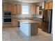 Well-appointed kitchen with granite counters, stainless steel appliances and center island at 19889 W Annika Dr, Litchfield Park, AZ 85340