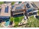 Aerial view of a private backyard featuring a pool, trampoline, lawn and covered patio, perfect for entertaining at 2210 W Calle Del Sol --, Phoenix, AZ 85085
