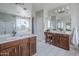 Bathroom with dual sinks, white quartz countertops, and a separate shower and tub at 2210 W Calle Del Sol --, Phoenix, AZ 85085
