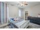 Bedroom with a twin bed, dresser, closet, and wood-look tile flooring at 2210 W Calle Del Sol --, Phoenix, AZ 85085
