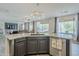 Open kitchen with granite countertops, dark cabinetry, and stainless steel appliances, perfect for cooking at 2210 W Calle Del Sol --, Phoenix, AZ 85085