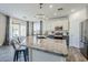 Spacious kitchen island featuring granite countertops, pendant lighting, and seating for four at 2210 W Calle Del Sol --, Phoenix, AZ 85085