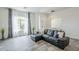 Bright living room with large windows, stylish drapes, and a comfortable leather sofa, perfect for relaxing at 2210 W Calle Del Sol --, Phoenix, AZ 85085