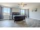 This bedroom boasts a king-size bed, wood-look tile flooring, and lots of natural light at 2210 W Calle Del Sol --, Phoenix, AZ 85085
