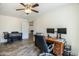 Large office space with dark wood floors, a ceiling fan, and lots of space for a desk at 2210 W Calle Del Sol --, Phoenix, AZ 85085