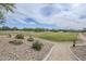 Outdoor park area featuring a winding walkway, open green space, and desert landscaping at 2210 W Calle Del Sol --, Phoenix, AZ 85085