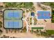Overhead view of meticulously maintained tennis courts and basketball court offering a vibrant recreational space at 2210 W Calle Del Sol --, Phoenix, AZ 85085