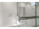 Bright bathroom with dual sinks, sleek white cabinetry, and a stylish glass-enclosed shower at 22528 E San Tan Blvd, Queen Creek, AZ 85142