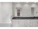 Contemporary bathroom boasts double sinks, modern vanities, and a spacious walk-in shower with bench at 22528 E San Tan Blvd, Queen Creek, AZ 85142