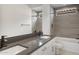 Bathroom with double sinks, tile backsplash, a built in shower, and a bathtub at 22528 E San Tan Blvd, Queen Creek, AZ 85142