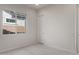 Neutral bedroom showcasing a plush carpet, large window and white walls at 22528 E San Tan Blvd, Queen Creek, AZ 85142