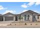 Charming single-story home with a two car garage, desert landscaping, and a tile roof at 22528 E San Tan Blvd, Queen Creek, AZ 85142