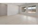 Bright living area showcasing large windows, neutral paint, and light tile flooring at 22528 E San Tan Blvd, Queen Creek, AZ 85142