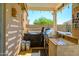Outdoor kitchen featuring a built-in grill and lots of counter space at 22783 W Cantilever St, Buckeye, AZ 85326