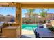 Outdoor poolside paradise featuring a built-in grill and a refreshing swimming pool at 22783 W Cantilever St, Buckeye, AZ 85326
