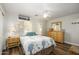 Bright bedroom with a queen-size bed, wood-look floors, and natural light from the window at 22783 W Cantilever St, Buckeye, AZ 85326