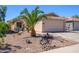 Single story home with desert landscaping, large driveway, and two car garage at 22783 W Cantilever St, Buckeye, AZ 85326