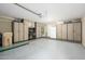 Organized garage with built-in cabinets, ample storage, and epoxy flooring at 22783 W Cantilever St, Buckeye, AZ 85326