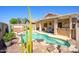 A backyard pool, patio, and outdoor dining area, perfect for entertaining with desert landscaping at 22783 W Cantilever St, Buckeye, AZ 85326
