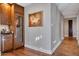 Chic bar area with a wine cooler and custom cabinetry for a sophisticated entertaining space at 2402 E Esplanade Ln # 1101, Phoenix, AZ 85016