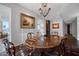 Beautiful dining room featuring a chandelier, wood table, and bright light at 2402 E Esplanade Ln # 1101, Phoenix, AZ 85016