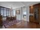 Elegant dining room with hardwood floors, chandelier, and large window views at 2402 E Esplanade Ln # 1101, Phoenix, AZ 85016