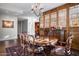 Inviting dining room featuring a chandelier and ornate wood detailing creating a warm, inviting space at 2402 E Esplanade Ln # 1101, Phoenix, AZ 85016