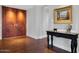 Grand entryway featuring double doors, hardwood flooring, and a decorative table at 2402 E Esplanade Ln # 1101, Phoenix, AZ 85016