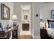 Hallway includes a wood console table with a decorative lamp and connects to the bedroom at 2402 E Esplanade Ln # 1101, Phoenix, AZ 85016