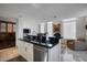 Bright kitchen with white cabinetry, marble floors, and stainless steel appliances at 2402 E Esplanade Ln # 1101, Phoenix, AZ 85016