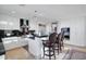 Modern kitchen features stainless steel appliances, white cabinetry, granite countertops, and island with bar seating at 2402 E Esplanade Ln # 1101, Phoenix, AZ 85016
