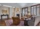 Warm living room with a fireplace, comfortable seating, and a patterned rug at 2402 E Esplanade Ln # 1101, Phoenix, AZ 85016