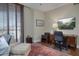 Office with a desk, chair, leopard print seating, and a mounted TV at 2402 E Esplanade Ln # 1101, Phoenix, AZ 85016
