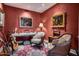 Well-appointed sitting room features eclectic decor, unique artwork, and cozy seating at 2402 E Esplanade Ln # 1101, Phoenix, AZ 85016