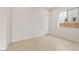 Bright, tile-floored bedroom featuring a large window and neutral decor at 26160 S 225Th Way, Queen Creek, AZ 85142