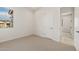 Comfortable carpeted bedroom with natural light and ample closet space at 26160 S 225Th Way, Queen Creek, AZ 85142